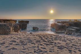 enchanting Beach with the sunset on the water