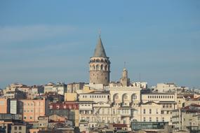 Beautiful landscape of Ä°stanbul, Turley, among the colorful buildings, at blue sky with clouds