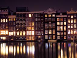 night panorama of buildings on the canal in Amsterdam