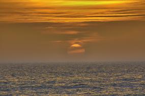 setting sun in the clouds on the horizon