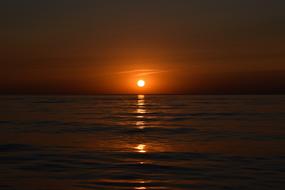 light path on the water from the setting sun
