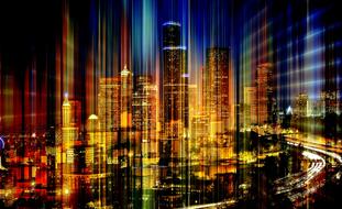 Skyline of city with Light Rays at night