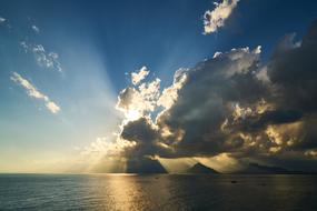 distant view of the mountain coast in the clouds