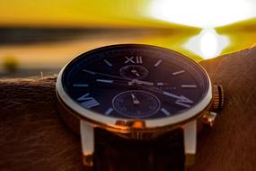 Wrist watch with the light on background