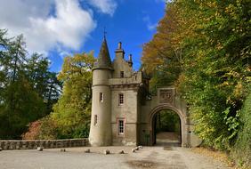 castle among the trees on a sunny autumn day