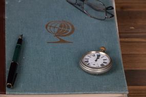 Old Atlas and pen