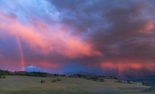 rainbow in the sky of colorful sunset