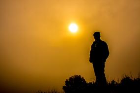male silhouette at Sunset Sky