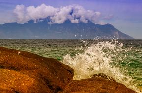 Sea wave splashing on scenic rocky coast, greece