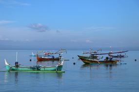 colorful Fishing boats anchored on Sea at dusk