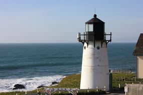 small lighthouse on the seaside