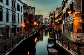 night photo of a canal in Venice, Italy