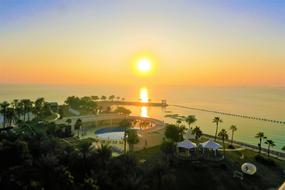 sunset over the resort on the coast