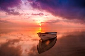 wooden boat on the lake in the morning