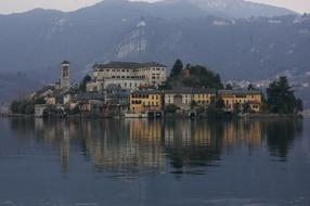Beautiful landscape of the island with buildings and trees, near the mountains