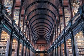 Beautiful and colorful library of the Trinity College, in Dublin, Ireland, with the lights