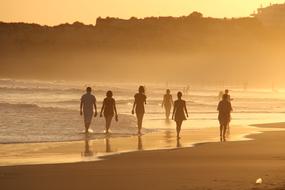 walk along the beach at dusk