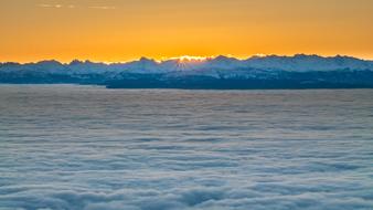 photo of yellow dawn over the Alps
