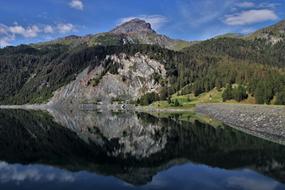 mirrored julierpass in a mountain lake