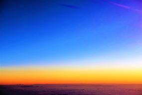 multicolored layered sunset on the horizon above the sea