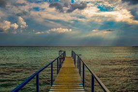 Beautiful and colorful pier, among the colorful and beautiful sea with the ripple, in Ayia Napa, Cyprus, Greece