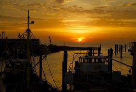 boats in the port at sunset