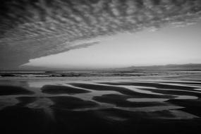 Beautiful and amazing beach in winter under the cloudy sky
