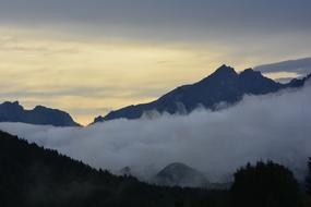 fog in a mountain valley at dusk in bavaria