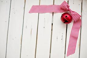 pink bell with checkered ribbon