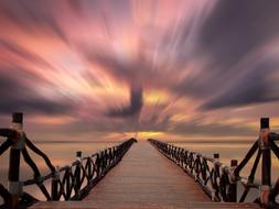 landscape of romantic sunset over the sea pier