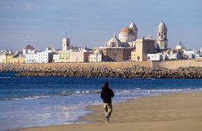 tourist is walking along the coast in Cadiz