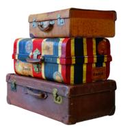 stack of multicolored vintage suitcases