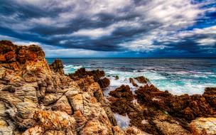 beautiful brown cliffs by the turquoise sea