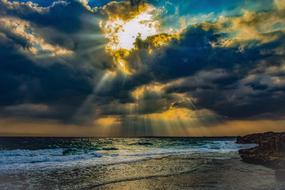 dramatic Sunset above sea at coastline