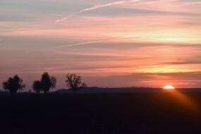 magical pink-gray sunset over the valley