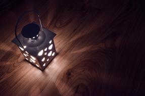 decorative lantern on a wooden floor