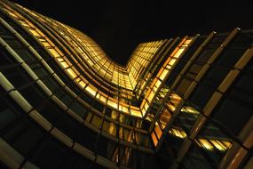 light in the windows of a high-rise office building