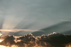 sunshine through gray clouds