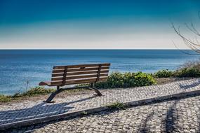 bench by the sea on a sunny day