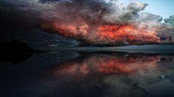 landscape of incredible Dark and red Clouds over the sea