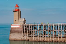 people fishing at lighthouse on sea, france, FÃ©camp