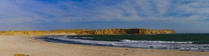 Landscape of the colorful cliff coast in the desert in Paracas, Peru, South America