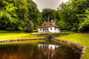 small old building near pond in beautiful park, Denmark, MÃ³n, Liselund