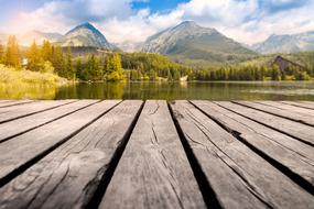 boardwalk in front of scenic mountain lake