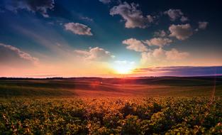 landscape of colorful atmospheric phenomenon over a green valley