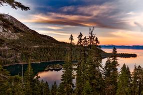 Beautiful Lake Tahoe, in the Emerald Bay, with the green trees in California, USA, at colorful and beautiful sunset