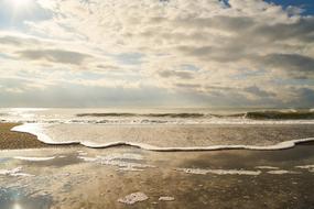clouds over coastal waves