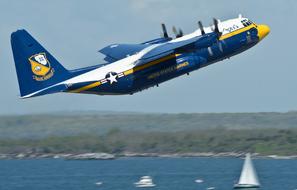 blue Fat Albert Airplane in flight