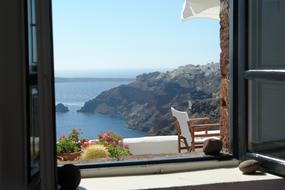 panorama view through window of Santorini bay