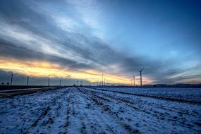 wind turbines in countryside at winter evening